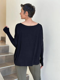 women's plant-based black relaxed fit jersey long sleeve top #color_black