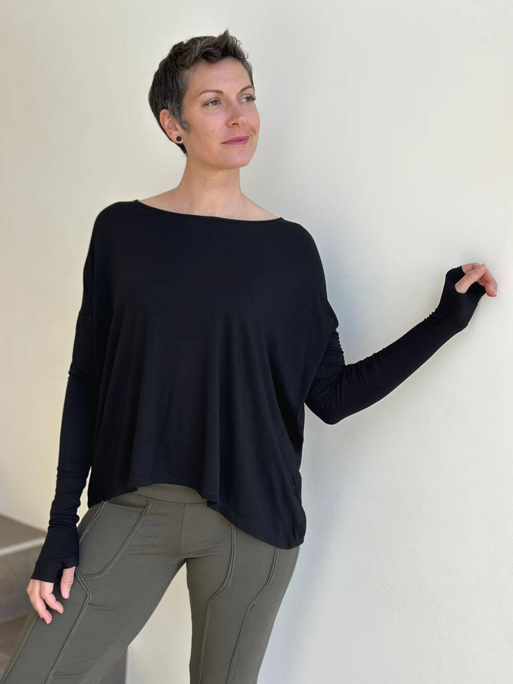 women's plant-based black relaxed fit jersey long sleeve top #color_black