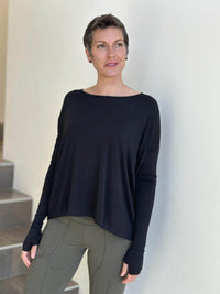 women's plant-based black relaxed fit jersey long sleeve top #color_black