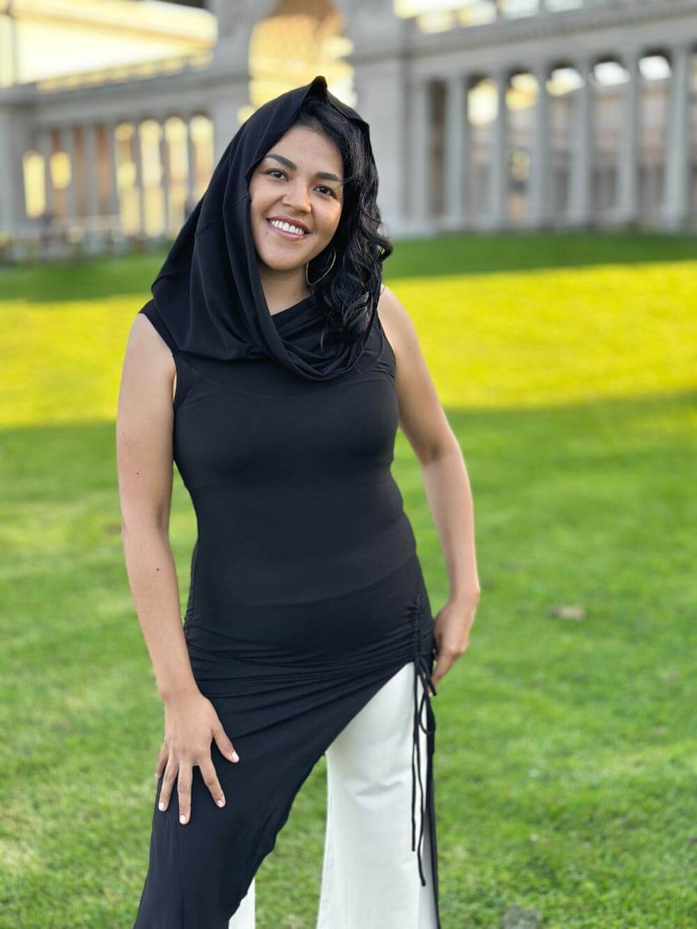 caraucci women's black full length tunic with adjustable side ruching and a loose cowl neck that can be worn as a hood or over the shoulders #color_black