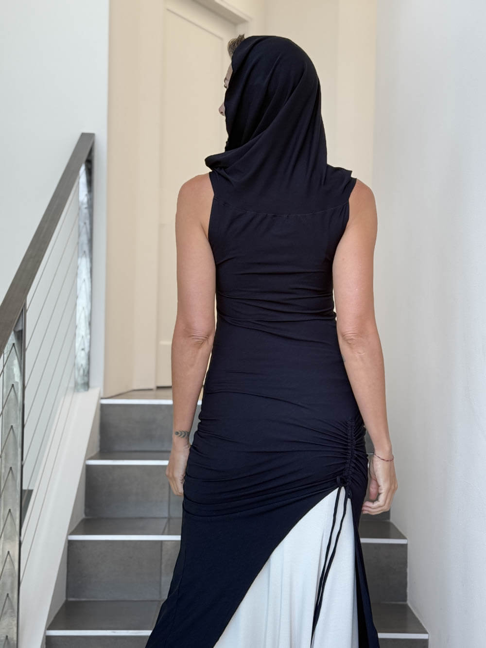 caraucci women's black full length tunic with adjustable side ruching and a loose cowl neck that can be worn as a hood or over the shoulders #color_black