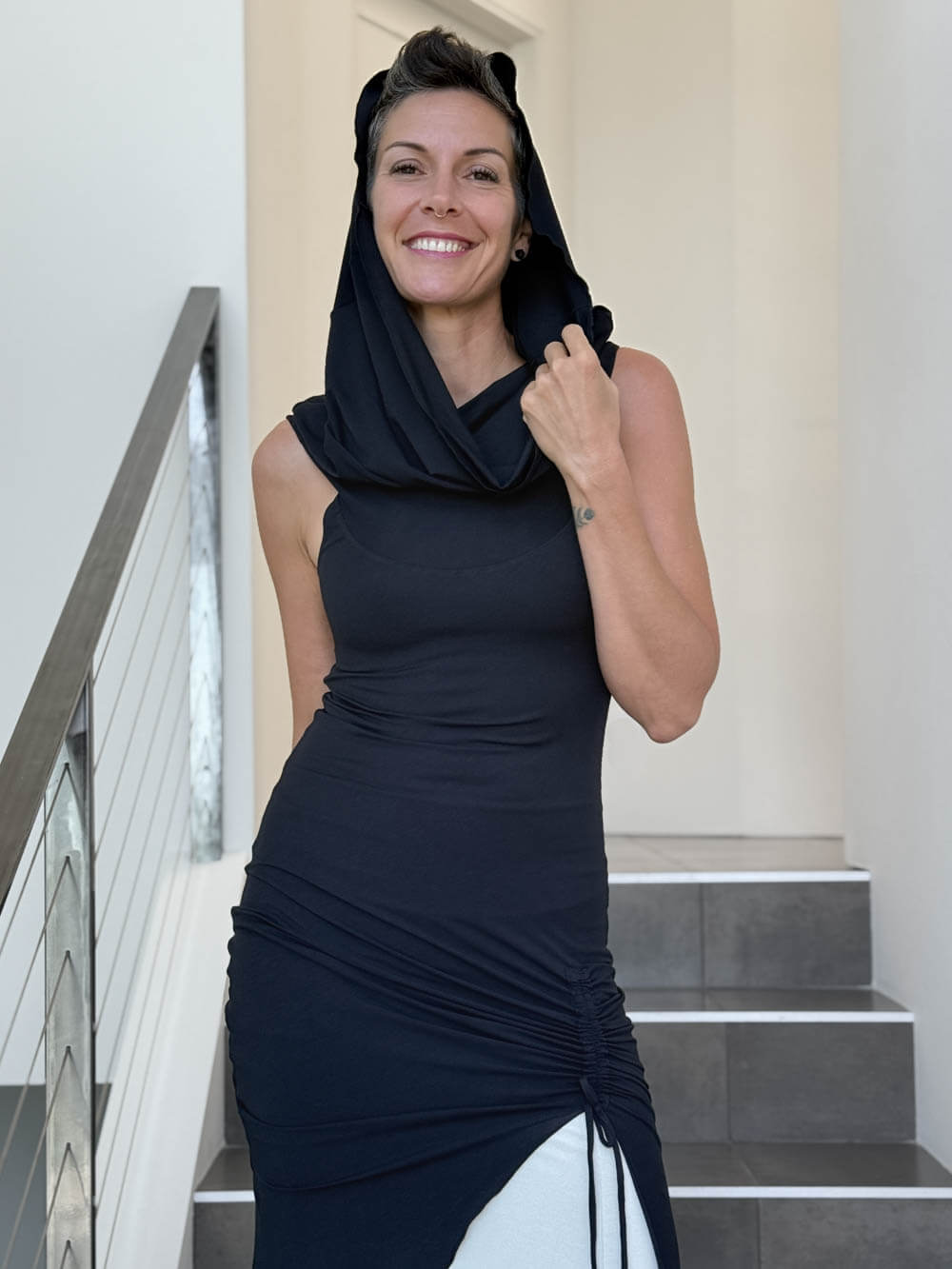 caraucci women's black full length tunic with adjustable side ruching and a loose cowl neck that can be worn as a hood or over the shoulders #color_black