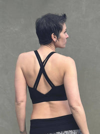 caraucci stretchy full coverage black yoga bra top with criss cross back straps #color_black