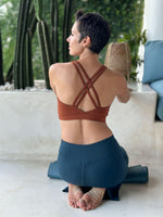 caraucci stretchy full coverage burnt orange yoga bra top with criss cross back straps #color_copper