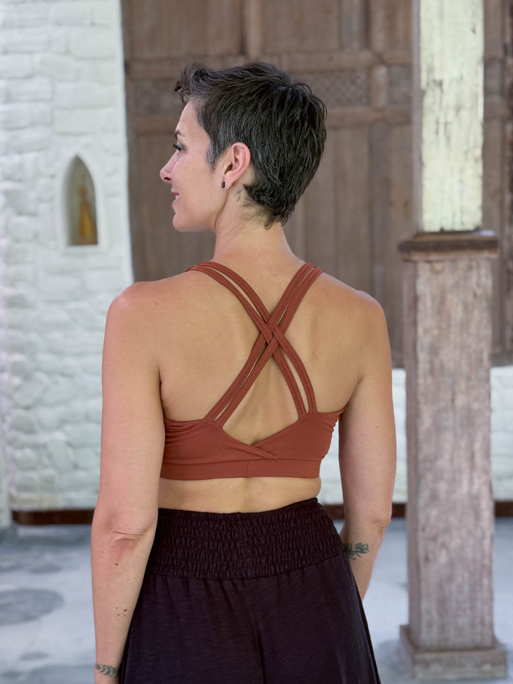 caraucci stretchy full coverage burnt orange yoga bra top with criss cross back straps #color_copper