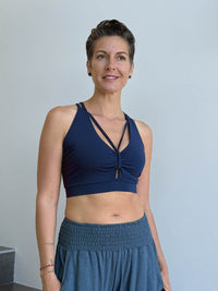 caraucci stretchy full coverage navy blue yoga bra top with criss cross back straps #color_navy