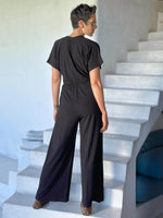 caraucci black one-piece v neck pantsuit with pockets and flare legs #color_black