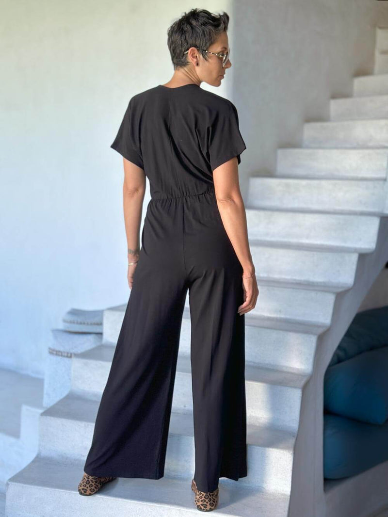 caraucci black one-piece v neck pantsuit with pockets and flare legs #color_black