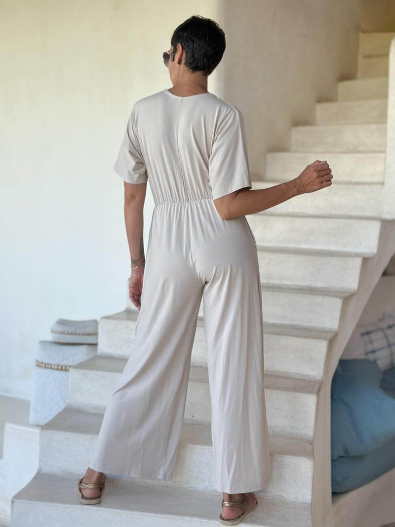 caraucci cream one-piece v neck pantsuit with pockets and flare legs #color_cream