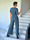 caraucci teal blue one-piece v neck pantsuit with pockets and flare legs #color_teal