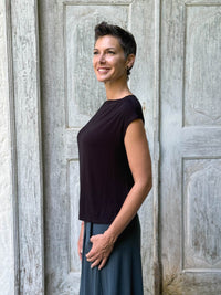 CARAUCCI Erna top in black lightweight rayon jersey with cap sleeves and draped neckline #color_black