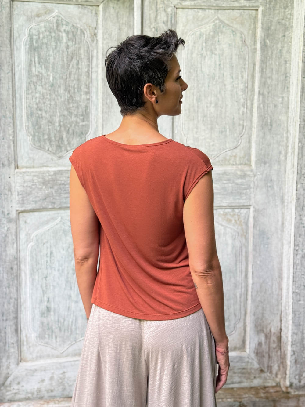 CARAUCCI Erna top in soft orange lightweight rayon jersey with cap sleeves and draped neckline #color_copper