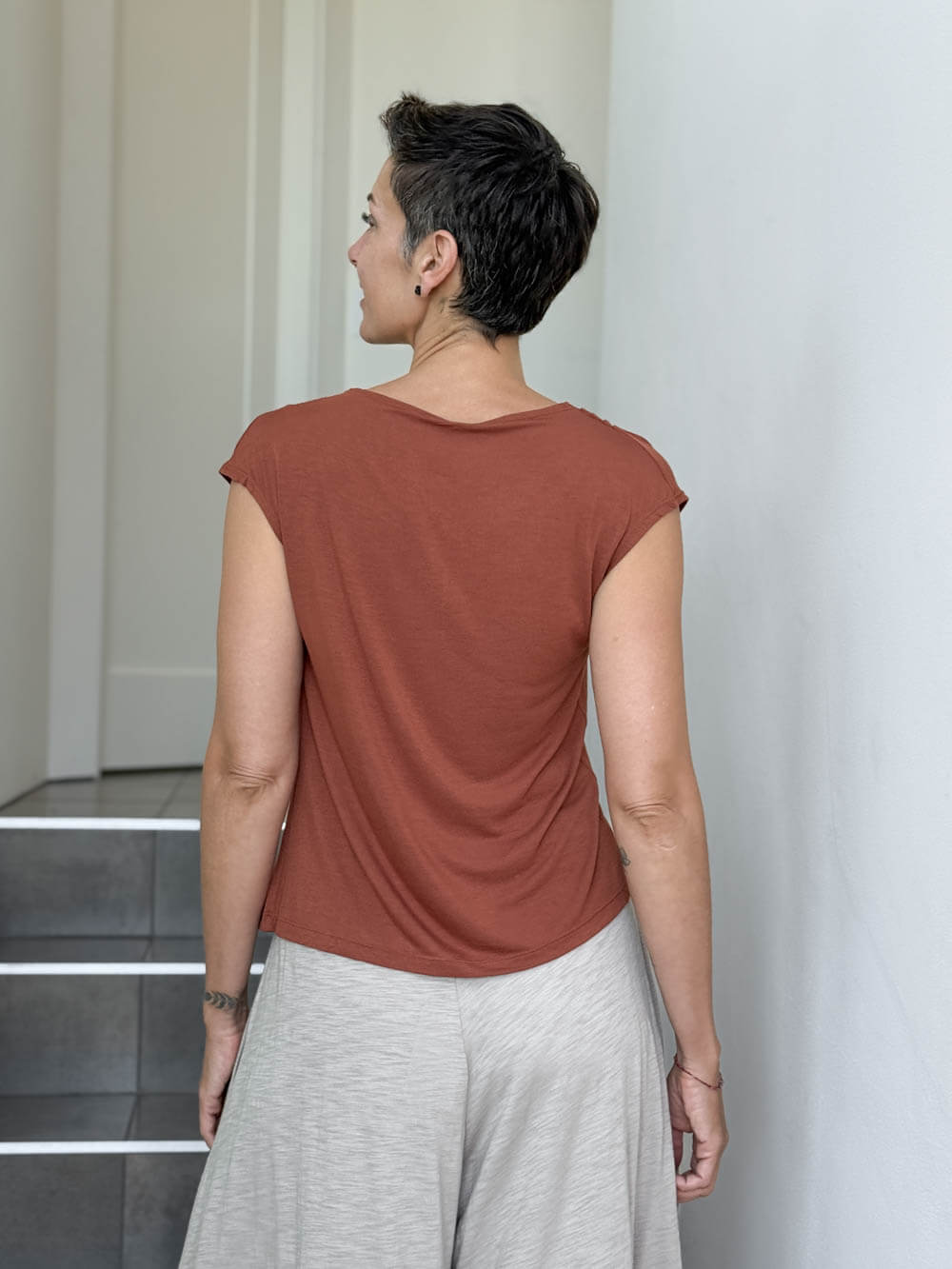 CARAUCCI Erna top in soft orange lightweight rayon jersey with cap sleeves and draped neckline #color_copper