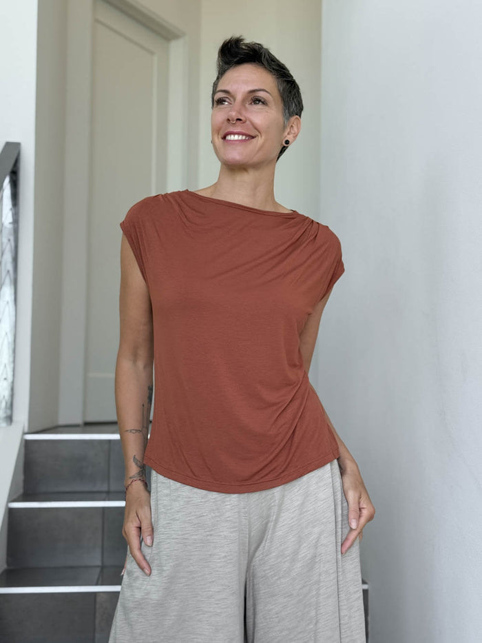 CARAUCCI Erna top in soft orange lightweight rayon jersey with cap sleeves and draped neckline #color_copper