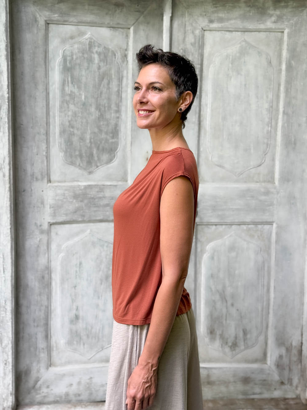 CARAUCCI Erna top in soft orange lightweight rayon jersey with cap sleeves and draped neckline #color_copper