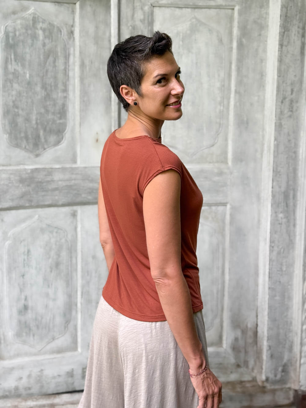 CARAUCCI Erna top in soft orange lightweight rayon jersey with cap sleeves and draped neckline #color_copper