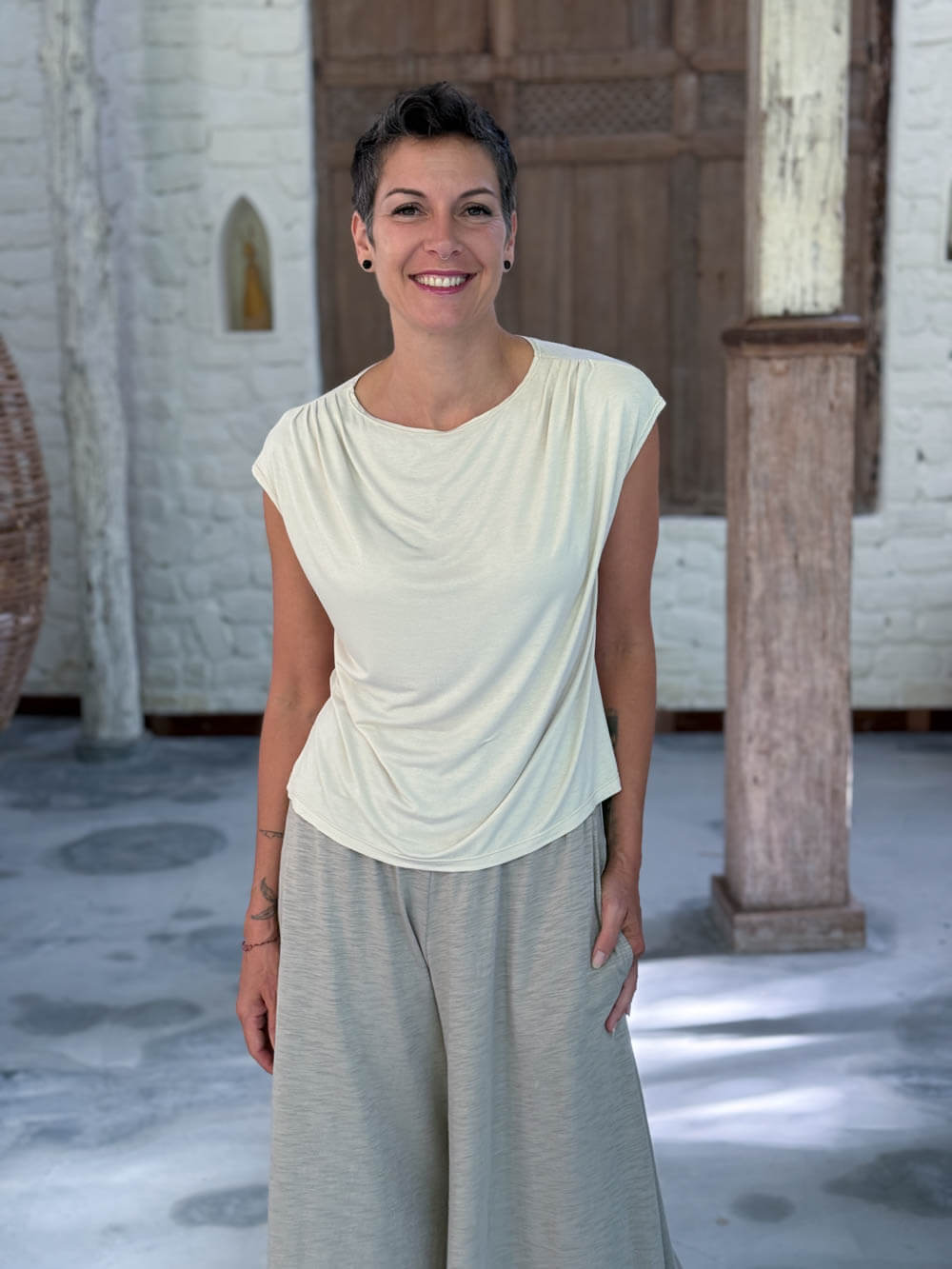 CARAUCCI Erna top in soft cream lightweight rayon jersey with cap sleeves and draped neckline #color_cream