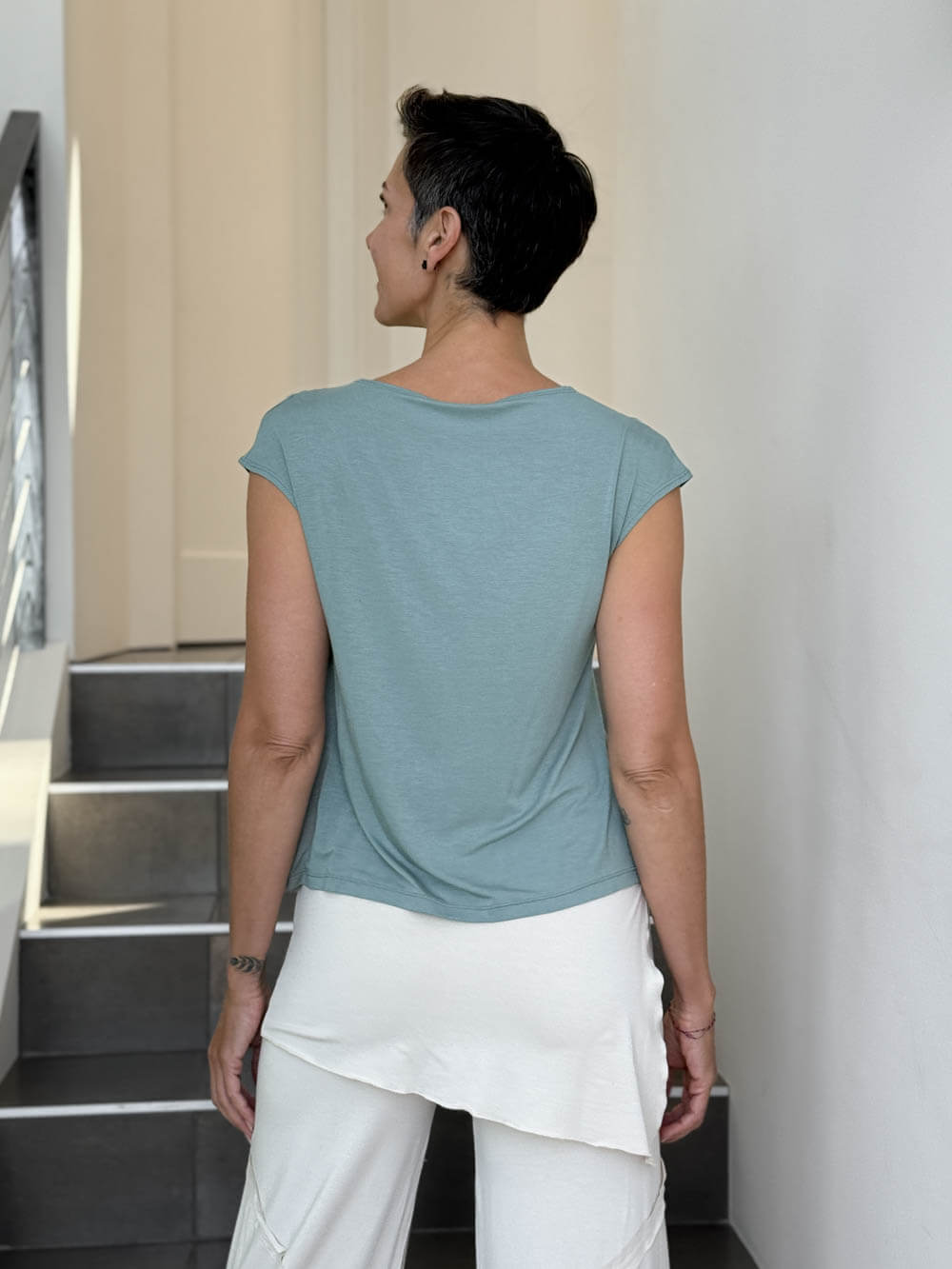 CARAUCCI Erna top in soft sage green lightweight rayon jersey with cap sleeves and draped neckline #color_moss