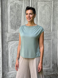 CARAUCCI Erna top in soft sage green lightweight rayon jersey with cap sleeves and draped neckline #color_moss