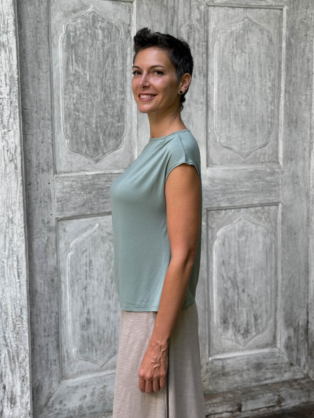 CARAUCCI Erna top in soft sage green lightweight rayon jersey with cap sleeves and draped neckline #color_moss