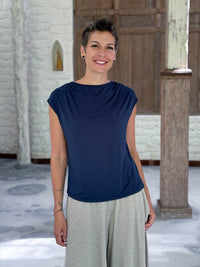 CARAUCCI Erna top in navy blue lightweight rayon jersey with cap sleeves and draped neckline #color_navy