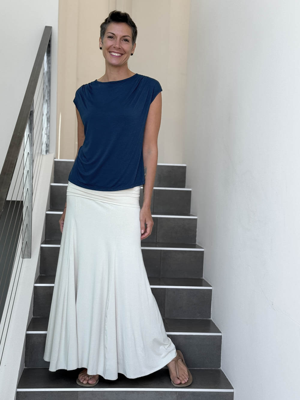 CARAUCCI Erna top in navy blue lightweight rayon jersey with cap sleeves and draped neckline #color_navy