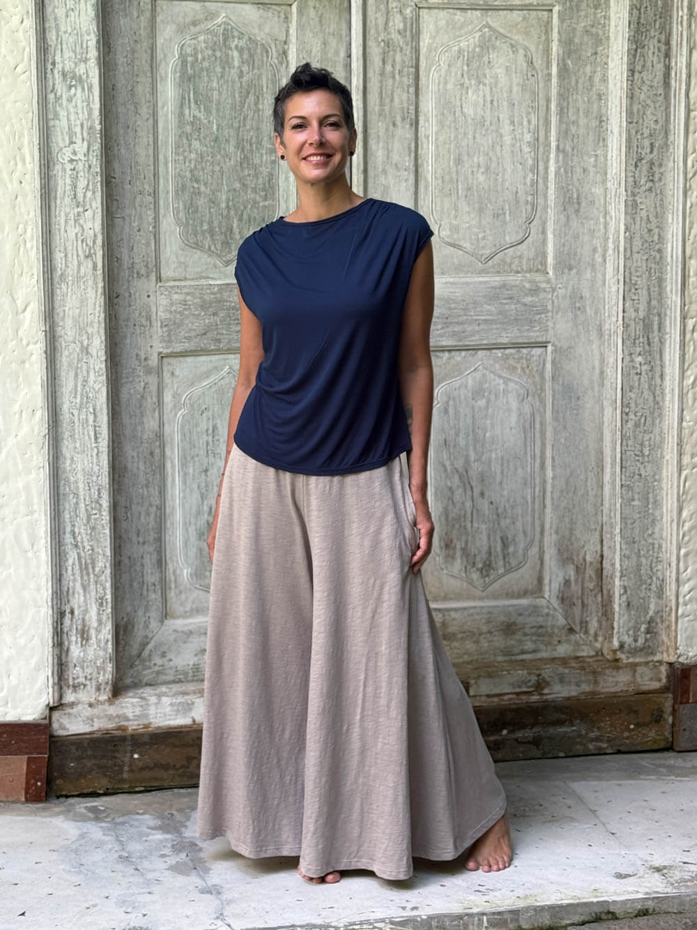 CARAUCCI Erna top in navy blue 
lightweight rayon jersey with cap sleeves and draped neckline #color_navy