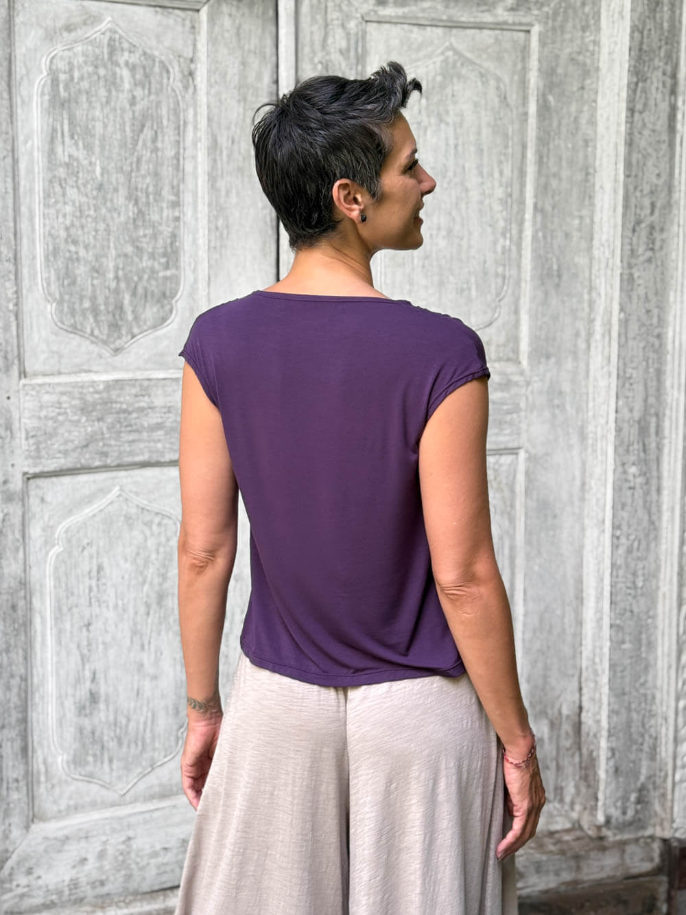 CARAUCCI Erna top in purple lightweight rayon jersey with cap sleeves and draped neckline #color_plum