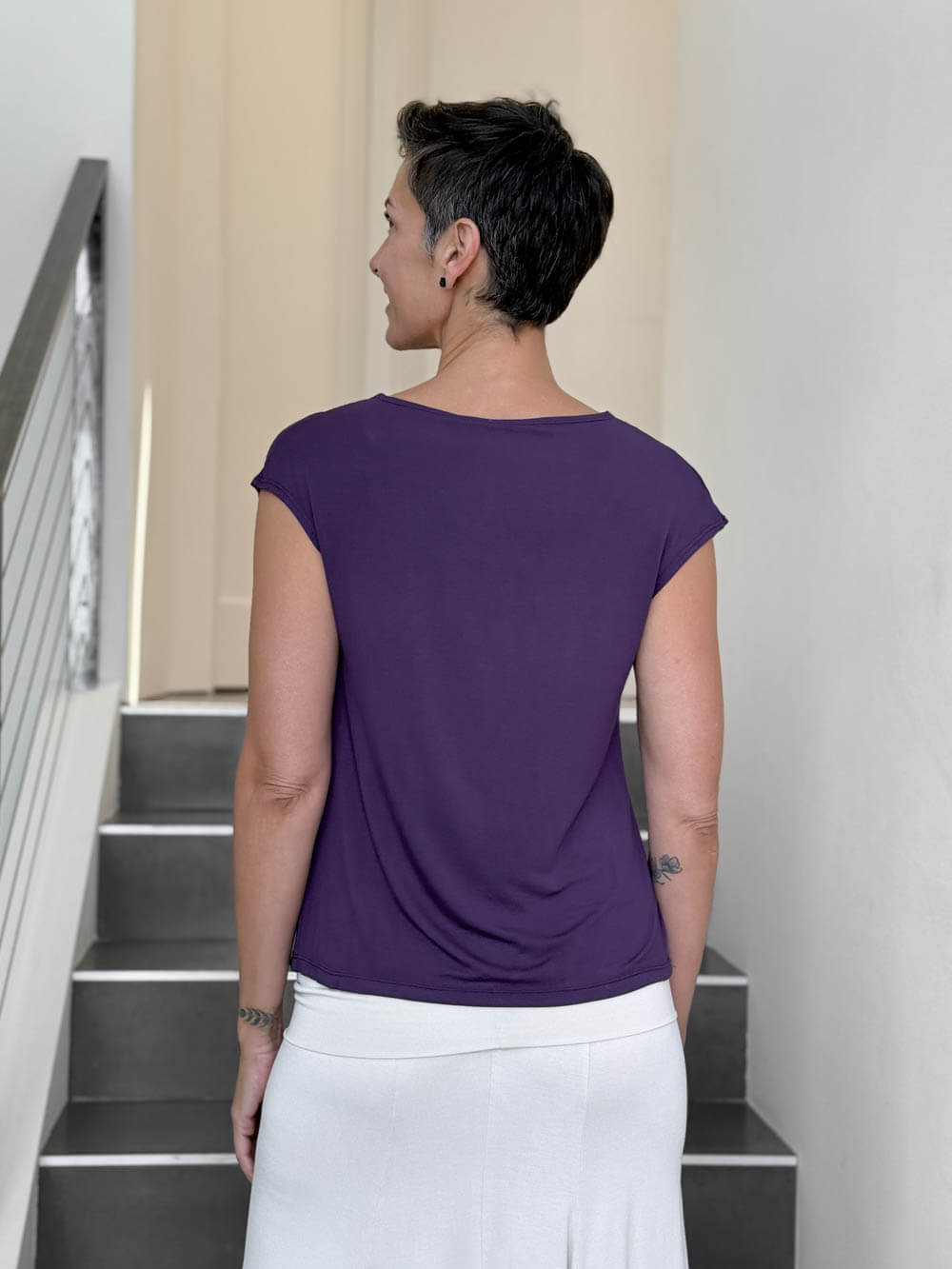 CARAUCCI Erna top in purple lightweight rayon jersey with cap sleeves and draped neckline #color_plum