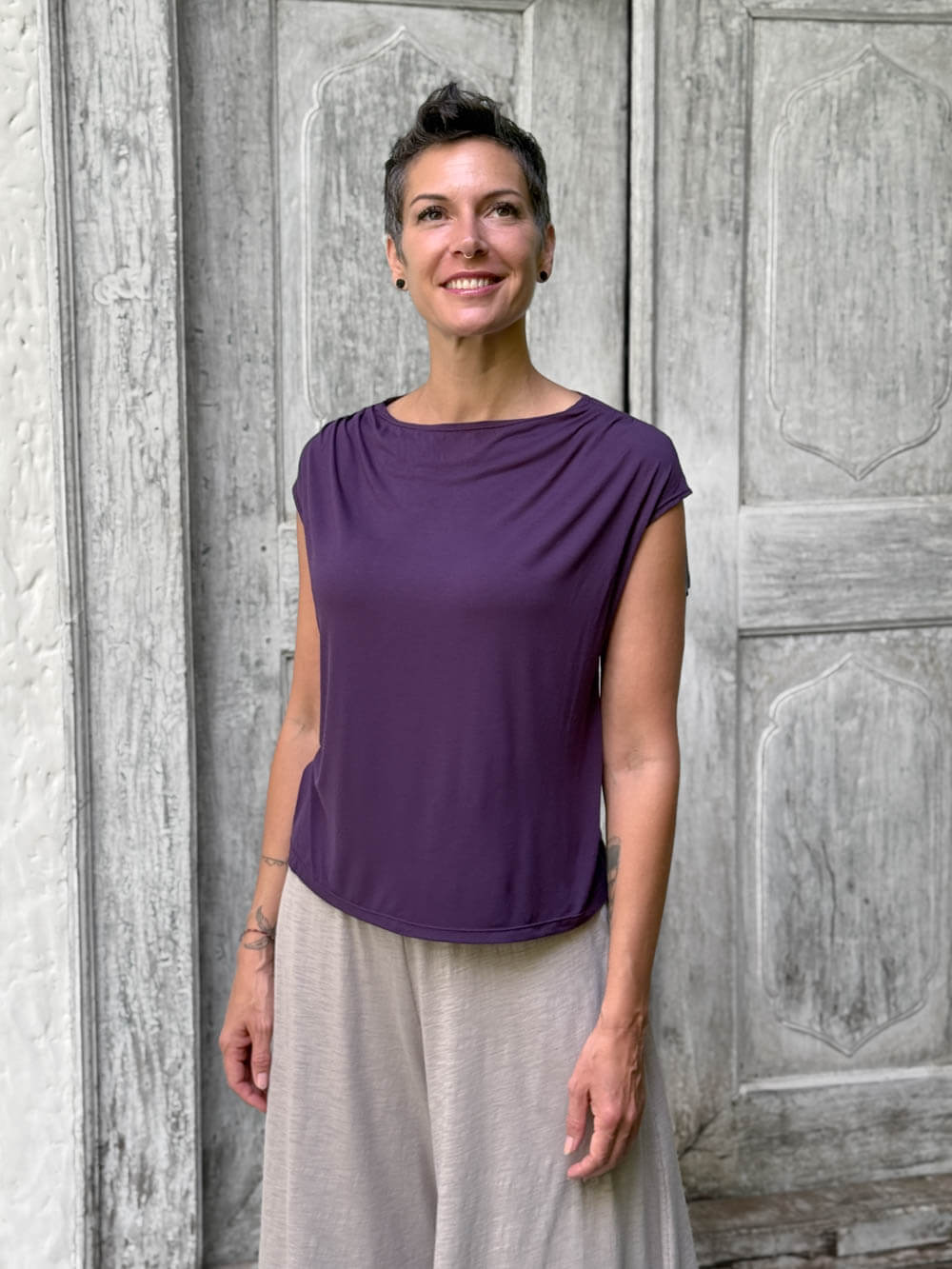 CARAUCCI Erna top in purple lightweight rayon jersey with cap sleeves and draped neckline #color_plum