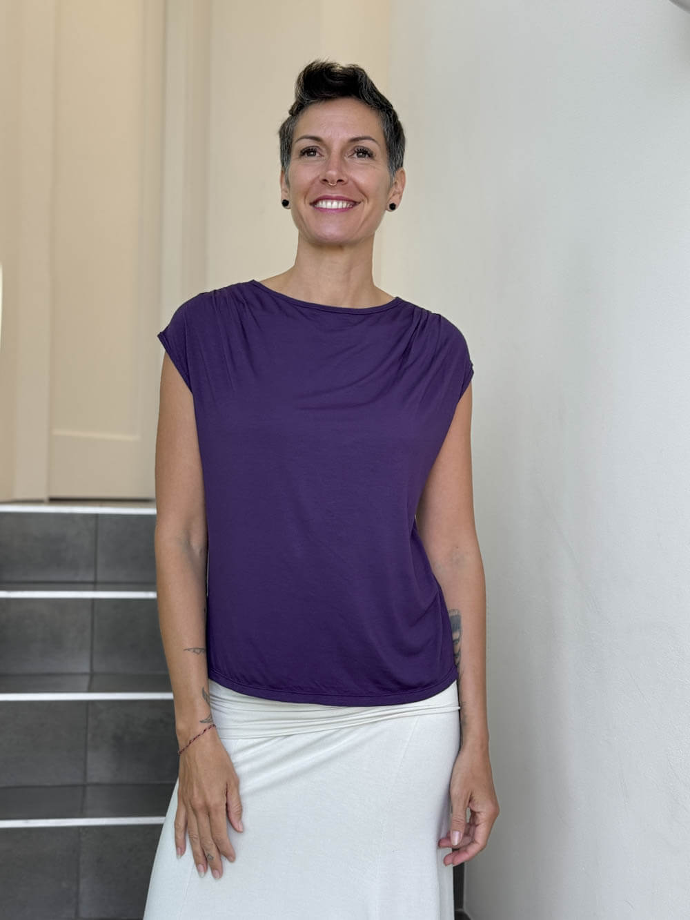 CARAUCCI Erna top in purple lightweight rayon jersey with cap sleeves and draped neckline #color_plum