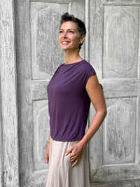 CARAUCCI Erna top in purple lightweight rayon jersey with cap sleeves and draped neckline #color_plum