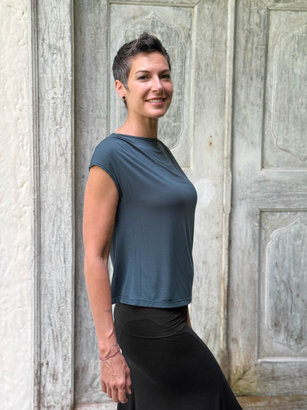 CARAUCCI Erna top in teal blue lightweight rayon jersey with cap sleeves and draped neckline #color_teal