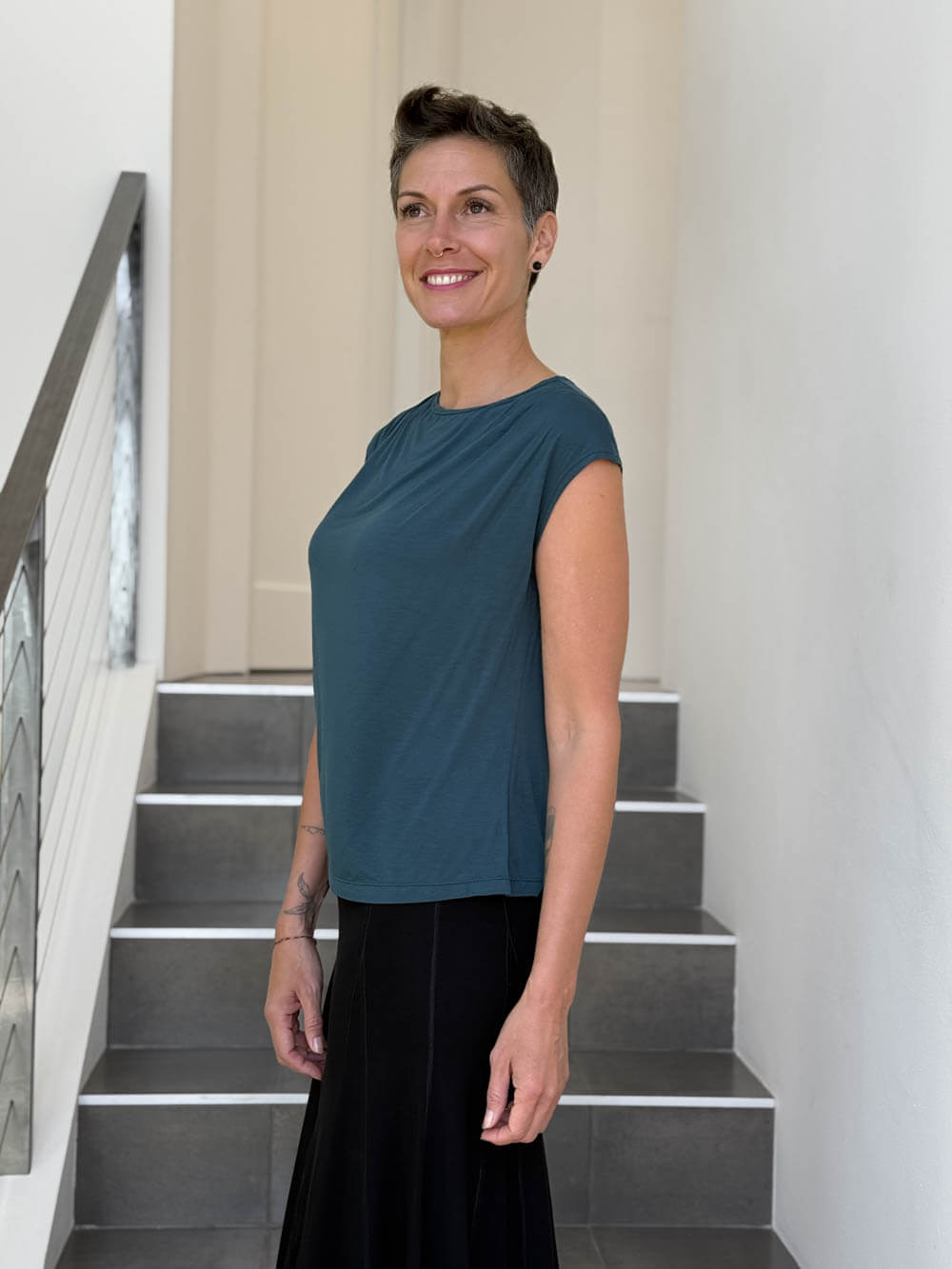 CARAUCCI Erna top in teal blue lightweight rayon jersey with cap sleeves and draped neckline #color_teal