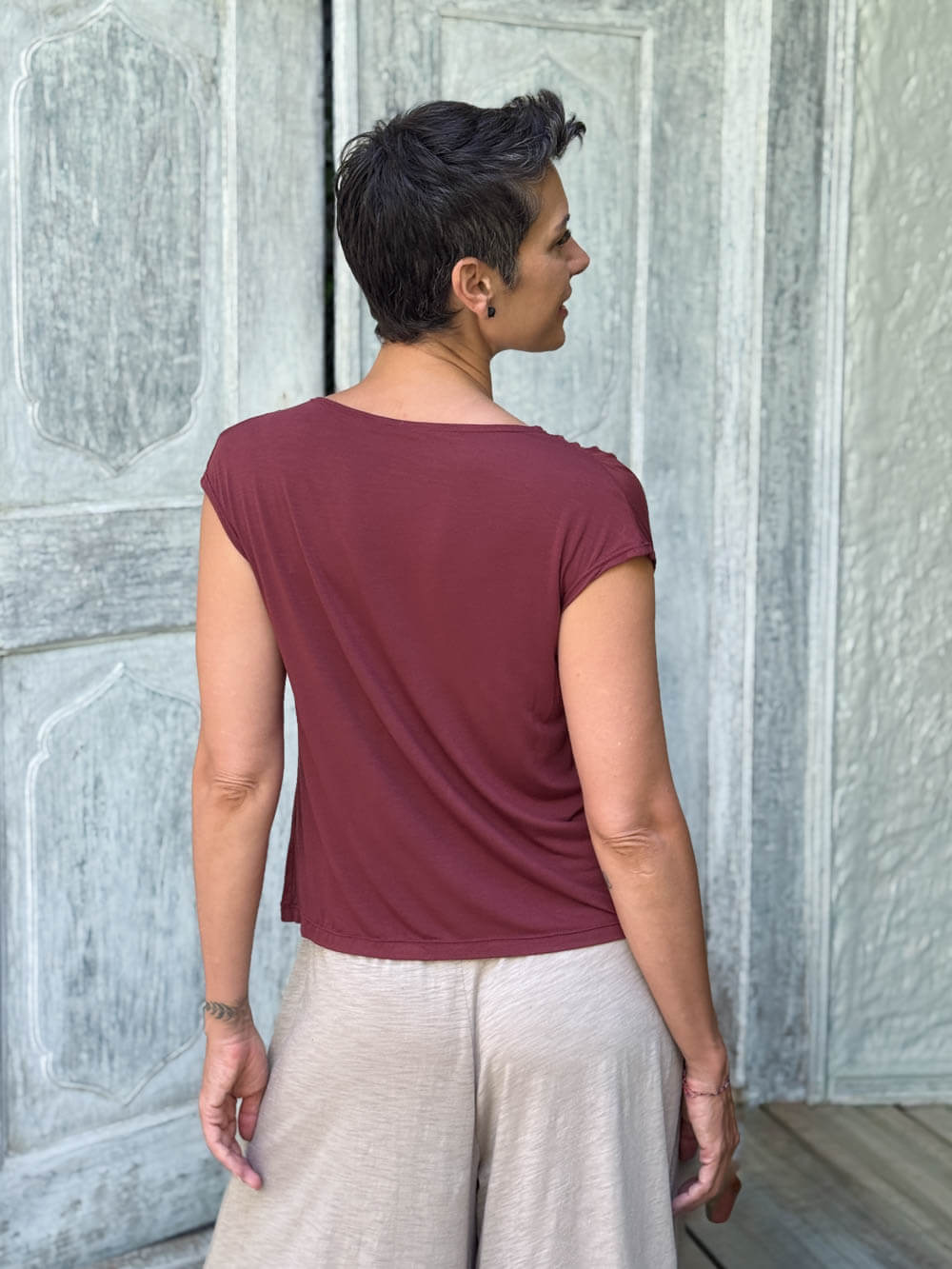 CARAUCCI Erna top in maroon lightweight rayon jersey with cap sleeves and draped neckline #color_wine