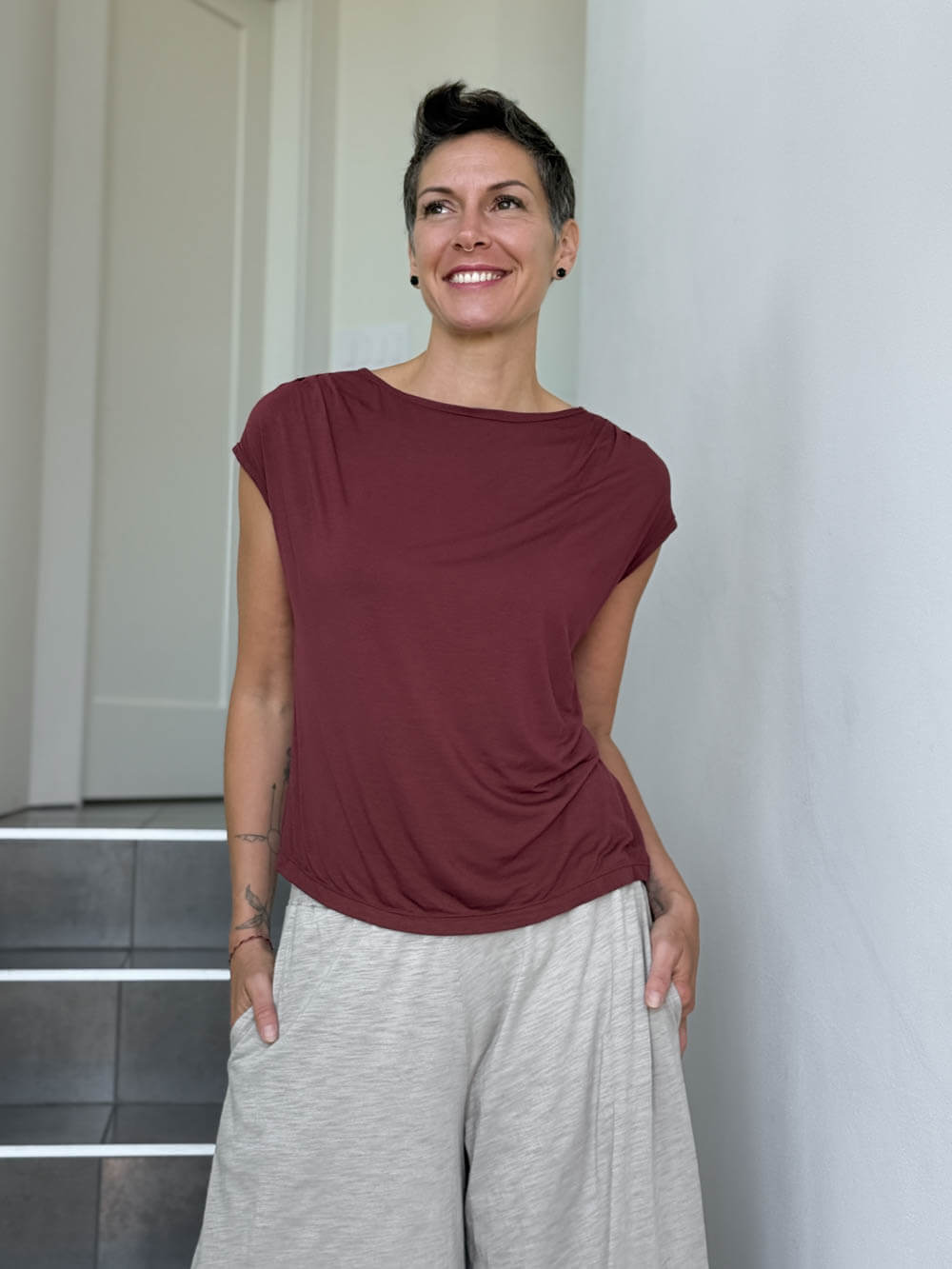 CARAUCCI Erna top in maroon lightweight rayon jersey with cap sleeves and draped neckline #color_wine