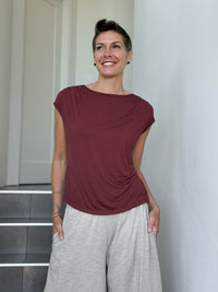 CARAUCCI Erna top in maroon lightweight rayon jersey with cap sleeves and draped neckline #color_wine