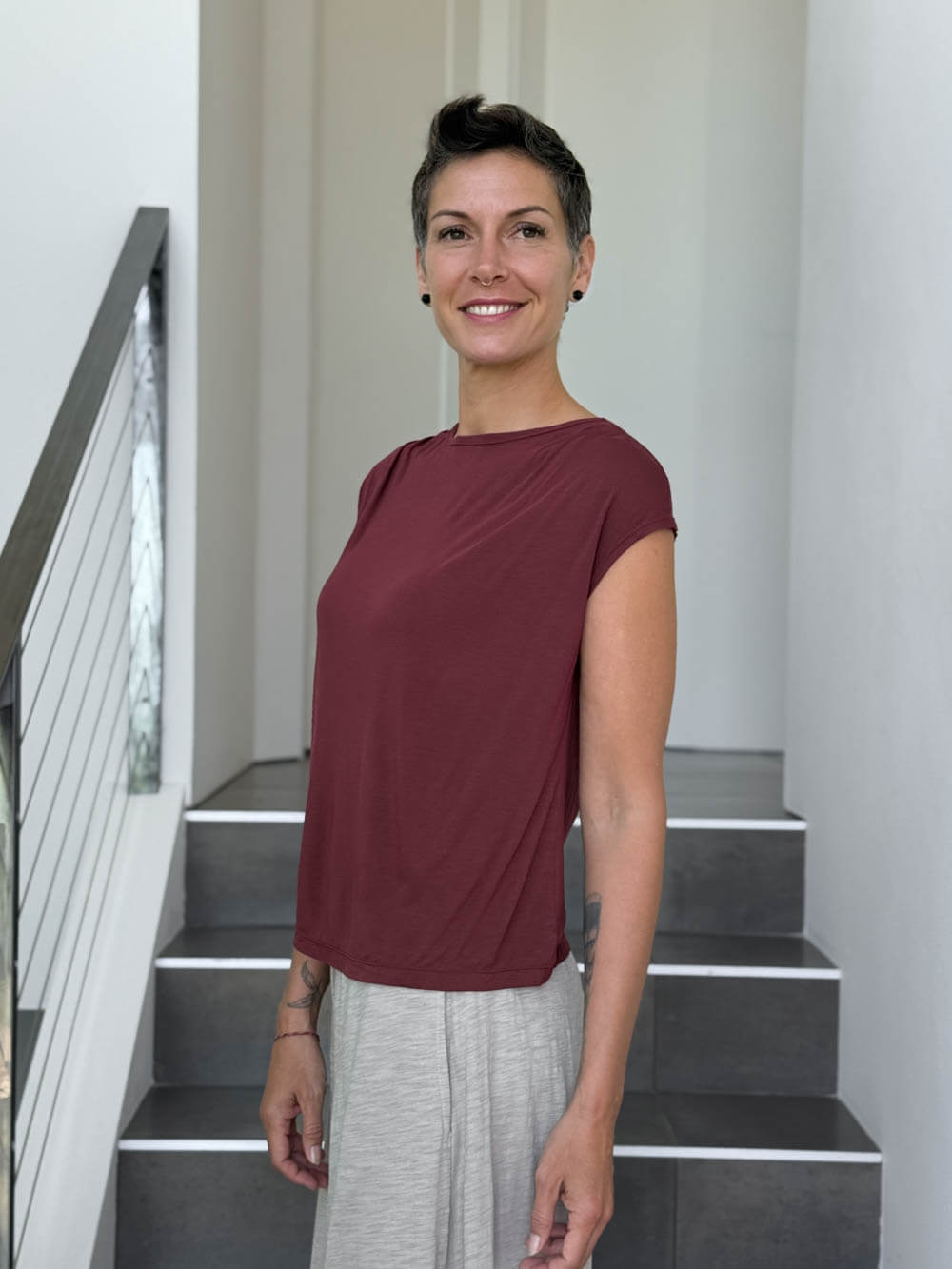 CARAUCCI Erna top in maroon lightweight rayon jersey with cap sleeves and draped neckline #color_wine