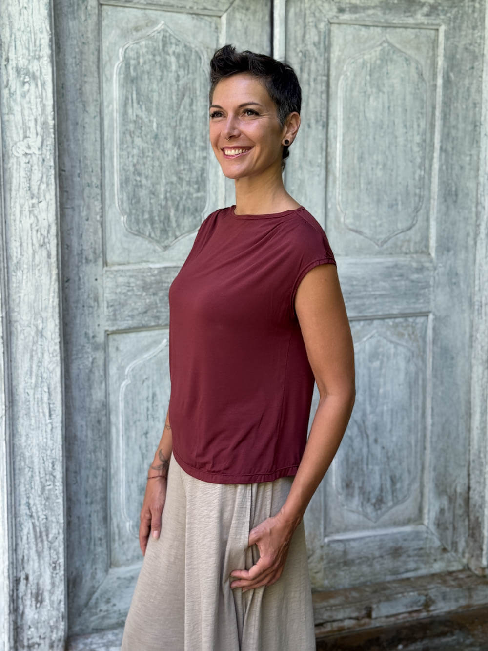 CARAUCCI Erna top in maroon lightweight rayon jersey with cap sleeves and draped neckline #color_wine