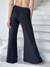 caraucci stretchy black flare-leg pants #color_black