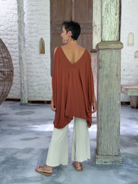 caraucci lightweight jersey draped soft orange kaftan tunic with open shoulders #color_copper