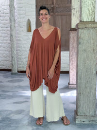 caraucci lightweight jersey draped soft orange kaftan tunic with open shoulders #color_copper