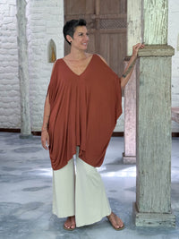 caraucci lightweight jersey draped soft orange kaftan tunic with open shoulders #color_copper