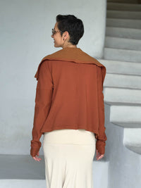 caraucci orange bamboo fleece jacket, shown open from the back with a draped shawl color with thumbholes and pockets #color_copper