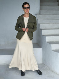 caraucci forest green bamboo fleece jacket, shown buttoned into a high cowl neck with thumbholes and pockets worn with a cream full length skirt #color_forest