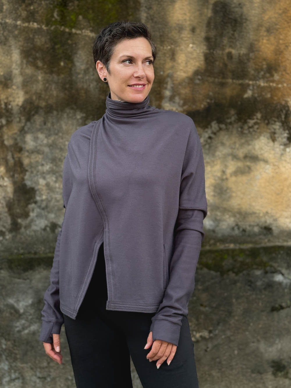 caraucci steel gray bamboo fleece jacket shown buttoned into a high cowl neck with thumbholes and pockets #color_steel