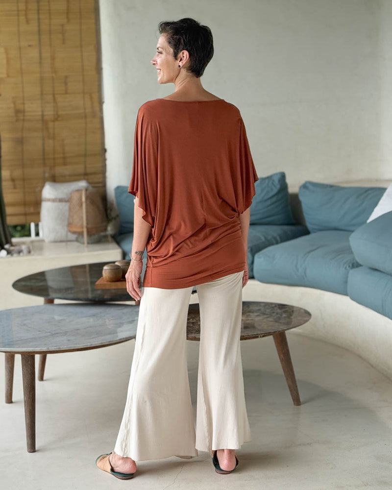 caraucci copper kimono tunic worn as a tunic with cream pants #color_copper