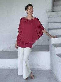 caraucci red kimono tunic worn as a tunic with cream pants #color_scarlet