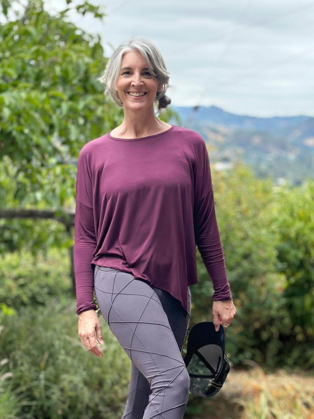 caraucci long sleeve round neck purple top with asymmetrical hemline and thumbholes #color_jam