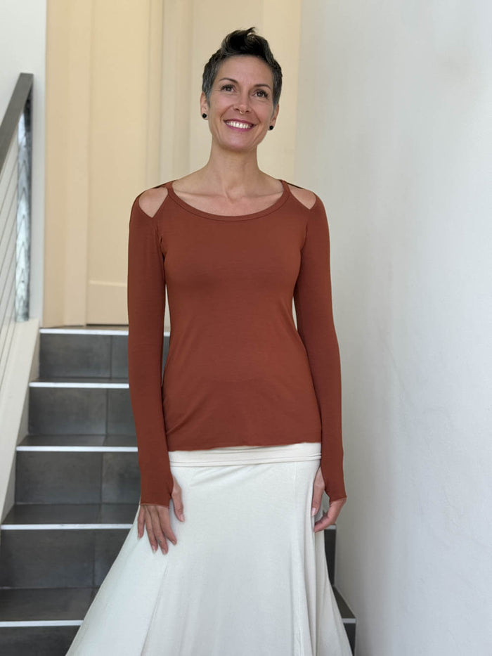 women's plant based stretchy rayon jersey long sleeve peekaboo shoulder burnt orange top with thumbholes #color_copper